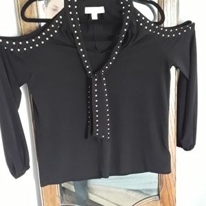 Michael Kors black blouse with open shoulders.